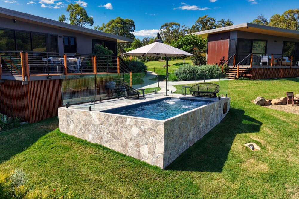 Plungie precast concrete pool finished in Mediterranean Blue ecoFinish