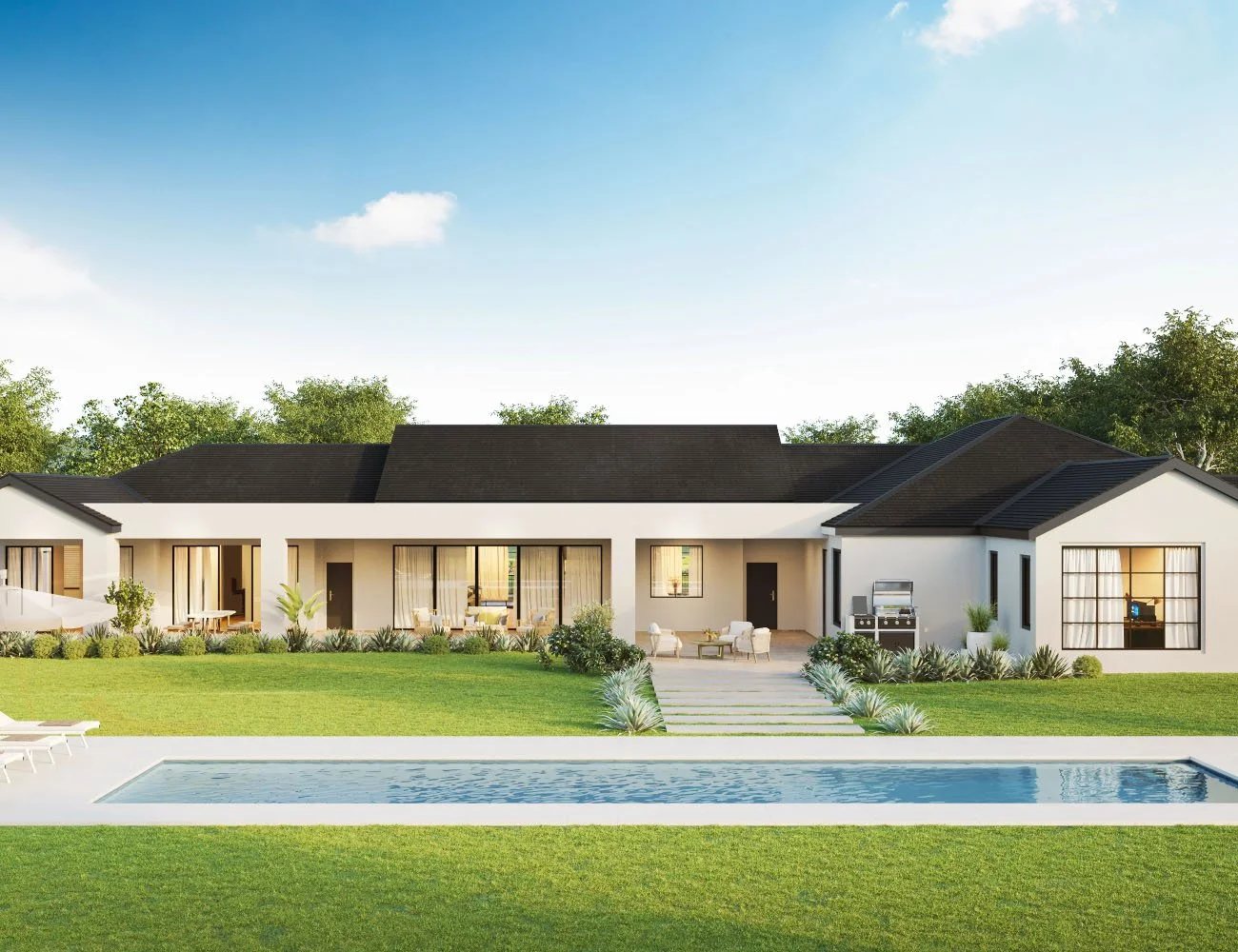 Lap Pool De Luxe in the Platinum Quartz colour in front of an open plan home
